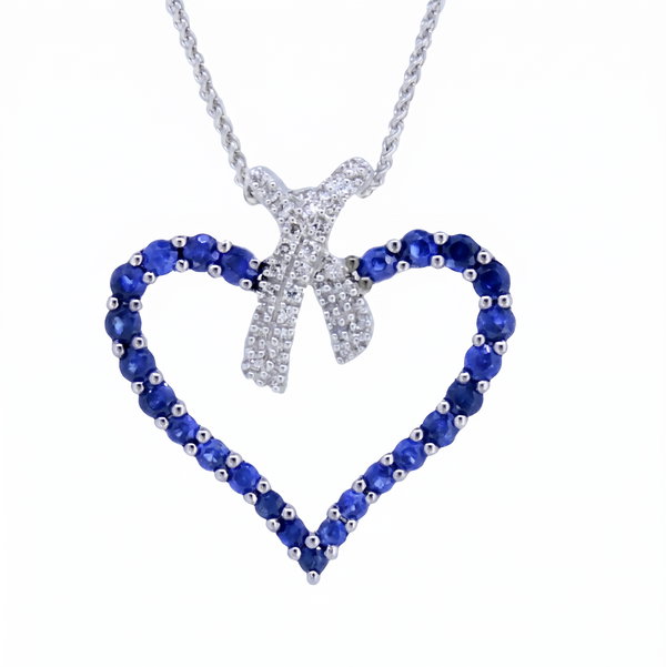 Closeup photo of 14K WHITE GOLD DIAMOND AND SAPPHIRE HEART PENDANT WITH CHAIN