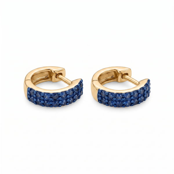 Closeup photo of 14KY Blue Sapphire Huggie Earrings