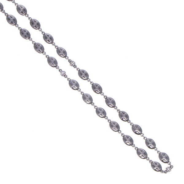 Closeup photo of Polished Cross Shield Chain With Black Diamond Stations 34"