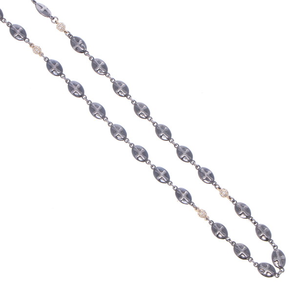 Closeup photo of Polished Cross Shield Chain With Yellow Gold Diamond Stations 21"