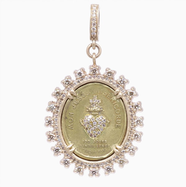 Closeup photo of French Sacred Heart Surmounted with a Cross Pendant