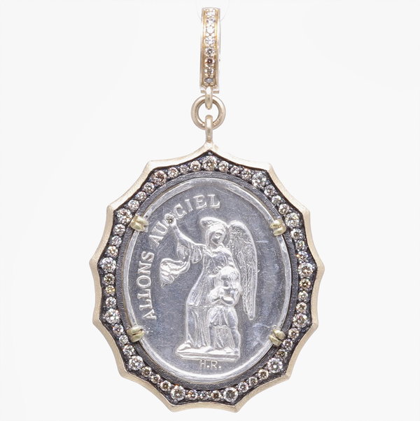 Closeup photo of Antique French Guardian Angel Pendant
