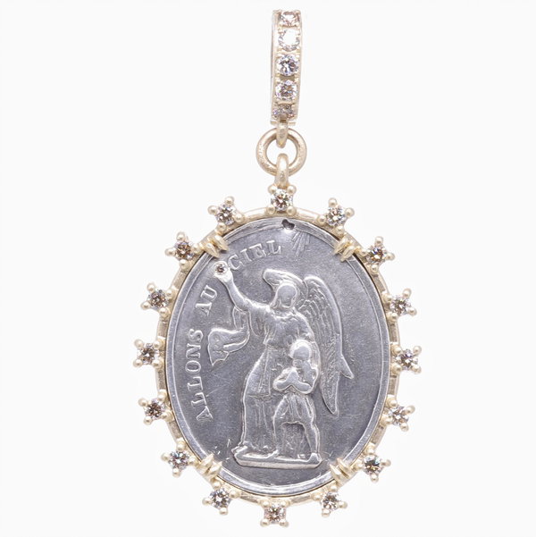 Closeup photo of Antique French Guardian Angel Pendant