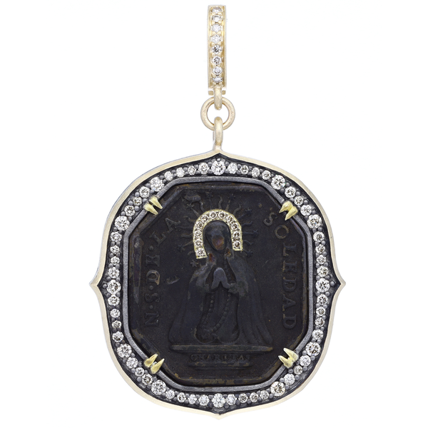 Closeup photo of Antique Virgin Mary Medal Pendant