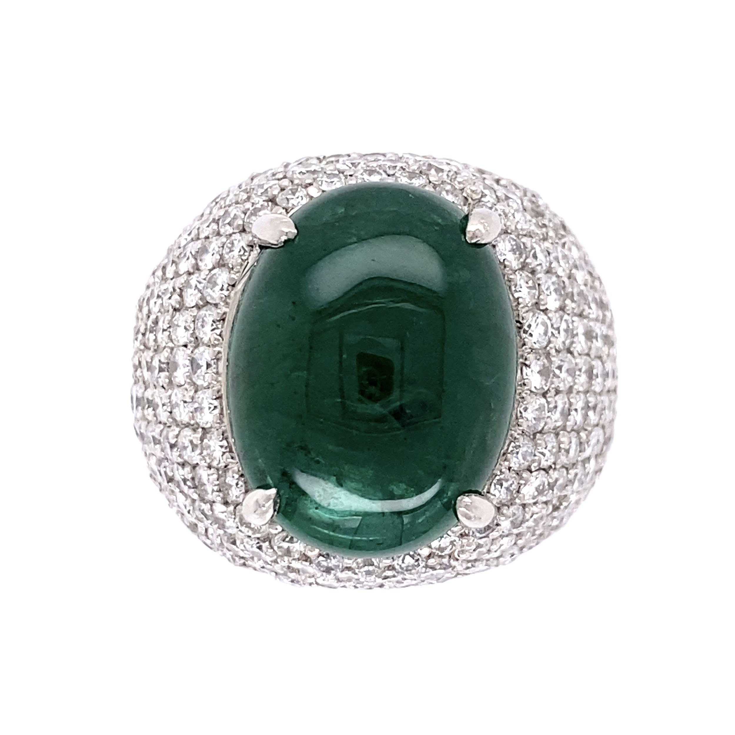 This exquisite Platinum 9.51ct Cabochon Emerald GIA and 2.65tcw Diamond Pave Dome Ring is truly a sight to behold. Crafted from the finest Platinum, this ring is adorned with a mesmerizing 9.51ct cabochon emerald that is certified by GIA with report number 2221156918. It is further adorned with a halo of 2.65tcw diamonds, creating a sophisticated and timeless design. It is size 6 and is the perfect statement piece for any occasion. Platinum 9.51ct Cabochon Emerald GIA & 2.65tcw Diamond Pave Dome Ring 21.2, s6