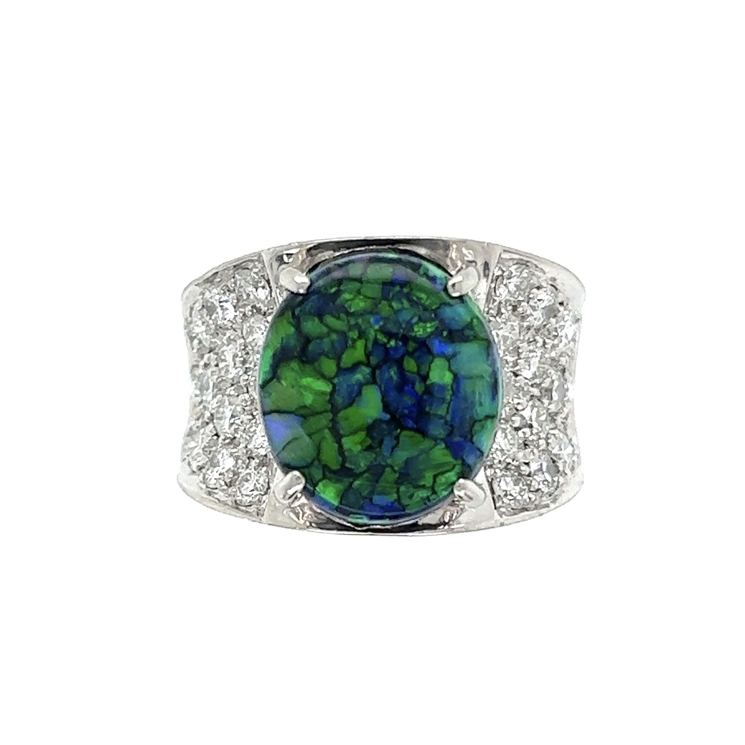 This Platinum 3.48ct Black Harlequin Opal & 1.33tcw Diamond Ring is simply stunning. Crafted of fine platinum, it showcases a beautiful 3.48ct black harlequin opal at the center and 1.33tcw of diamonds outlining it. The opal has a mesmerizing pattern and dark sapphire-blue hue, while the glittering diamonds provide the perfect contrast. The ring is also very comfortable to wear at 13.7g and a size US 5.75. This absolutely stunning piece is perfect for anyone looking for a unique and eye-catching fashion statement. Platinum 3.48ct Oval Black Harlequin Opal & 1.33tcw Diamond Ring 13.7g, s5.75