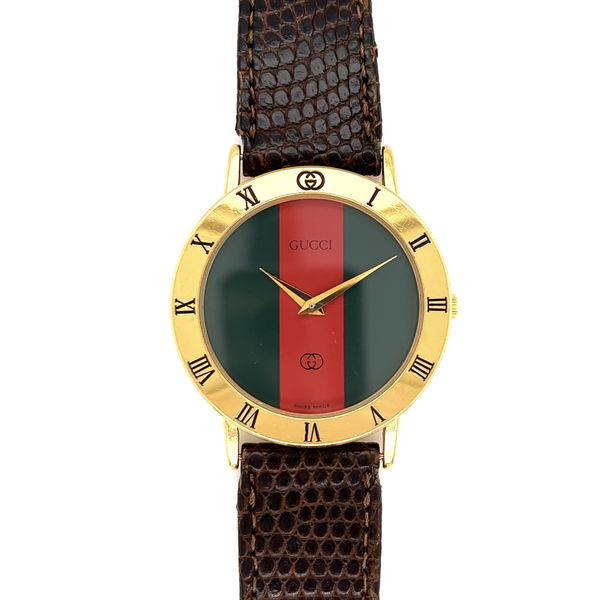 Closeup photo of GUCCI 3001M 33mm Red & Green Dial Quartz Gold Plate Watch on Lizard Strap