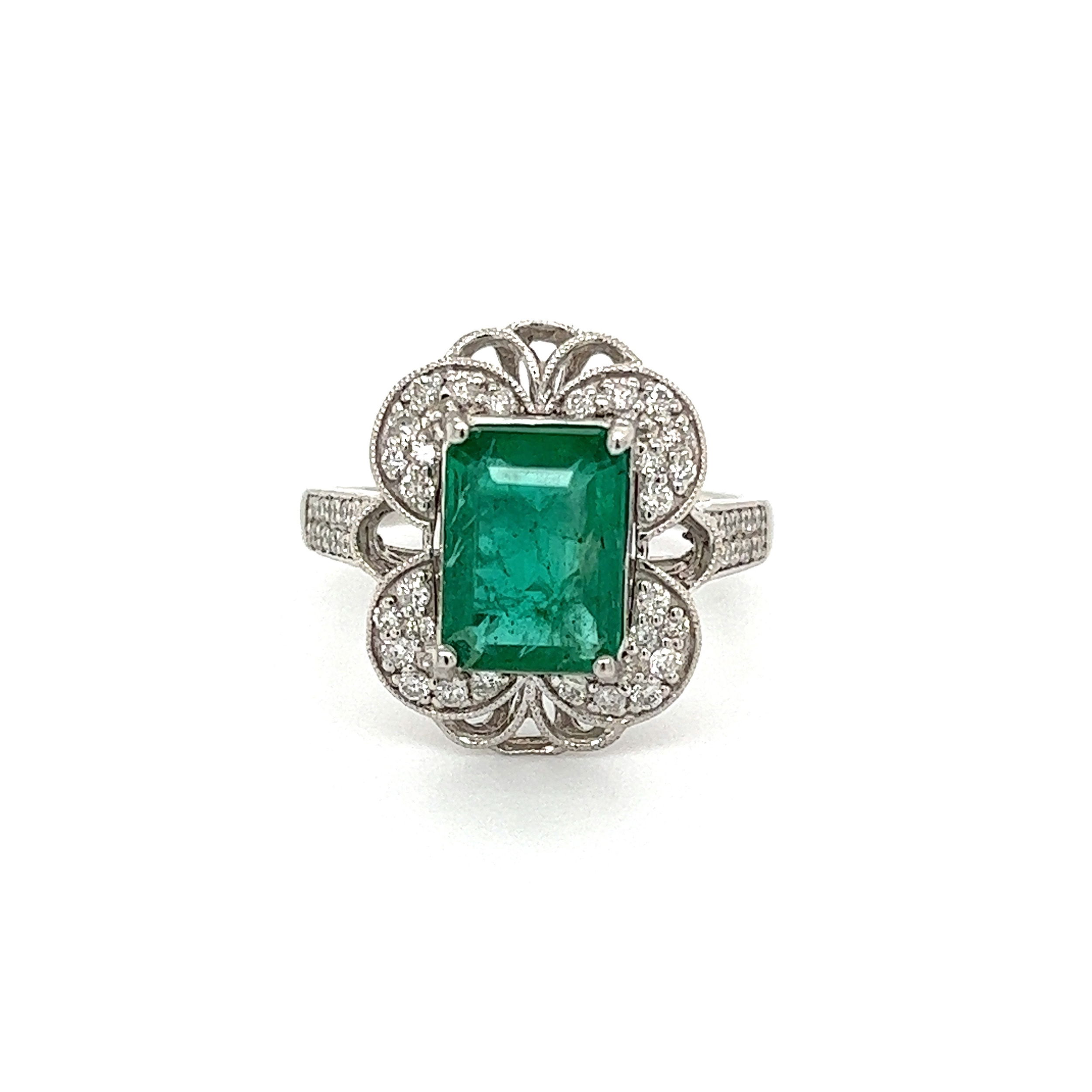 This stunning Platinum ORIANNE 2.32ct Emerald Cut Emerald GIA & .45tcw Diamond Ring 8.2g, s8 is absolutely stunning. Capturing your attention with its emerald cut center diamond that is GIA certified and rated F2 for color, the main stone measures 2.32 carats. Surrounding the main emerald is a halo of round brilliant diamonds that have a combined weight of .45tcw. The additional stones are rated G in color and SI in clarity. This ring is set in a high quality platinum setting and has a total weight of 8.2 grams. With its elegant and timeless design, this ring is the perfect addition to any jewelry collection.GIA# 6234039049, Zambian F2 Platinum ORIANNE 2.32ct Emerald Cut Emerald GIA & .45tcw Diamond Ring 8.2g, s8