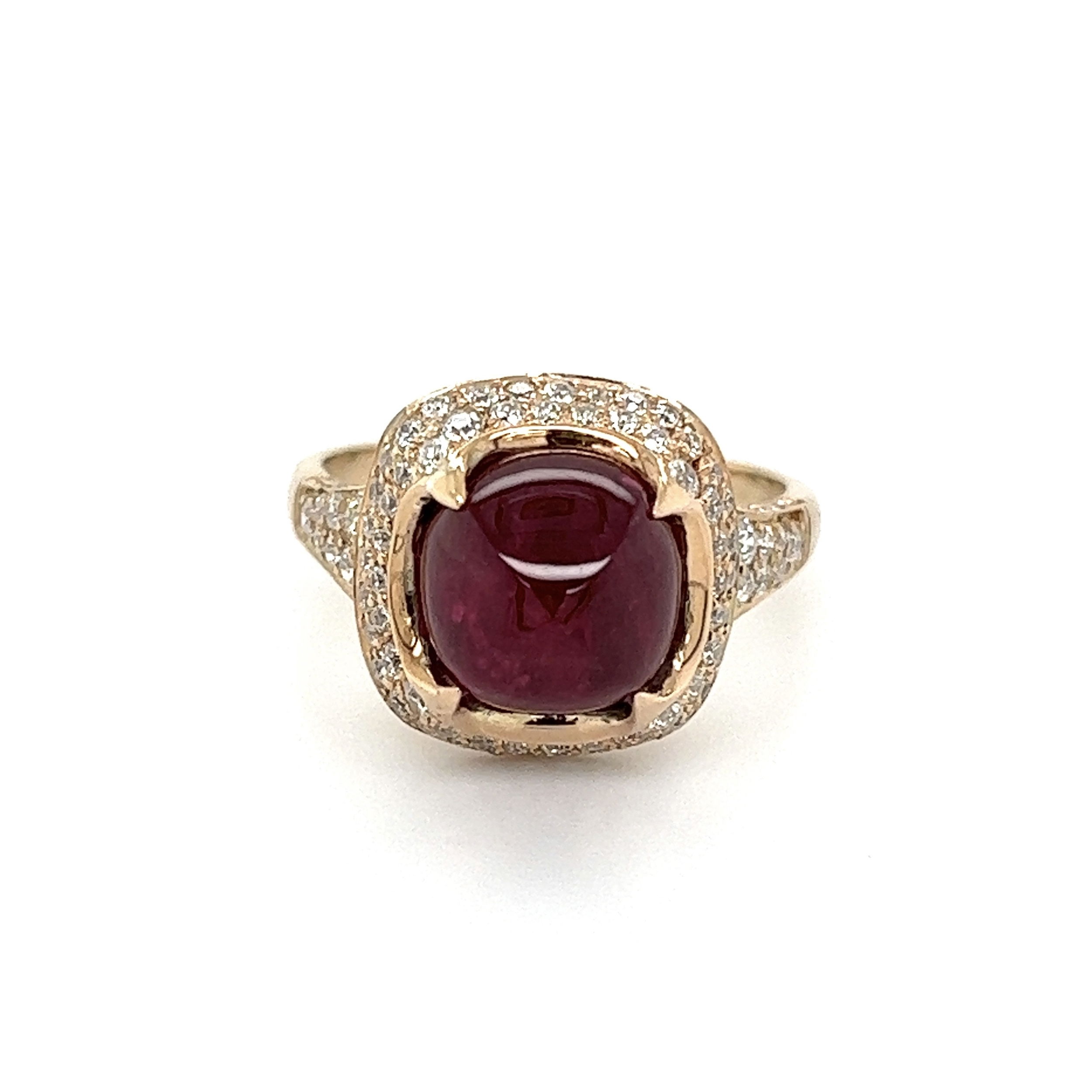 This stunning 18K yellow gold ring is an absolute showstopper. The centerpiece of the ring is a magnificent 5.29ct sugarloaf ruby from Mozambique that has been heated to enhance its beauty. Surrounding the ruby is an elegant halo of .86ctw diamonds that adds a fantastic sparkle to the piece. The total weight of the ring is 5.4g and it comes with the GRA Gem Lab Certificate #GRA2022-080672. Put on this stunning ring for a look that will turn heads, and be sure to keep it safe in the certificate as an heirloom for generations to come. 18K YG 5.29ct Sugarloaf Ruby & .86tcw Halo Diamond Ring 5.4g, s7.25