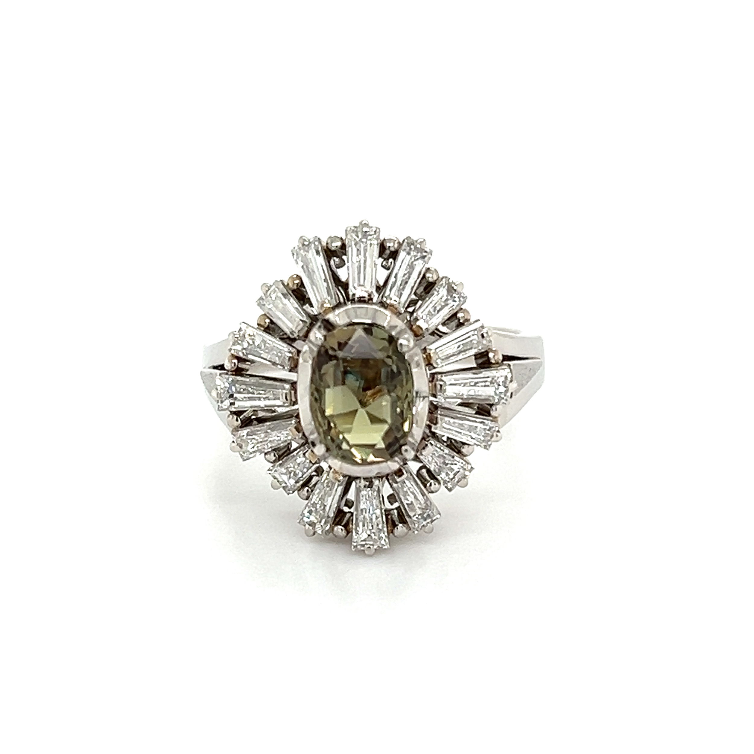 This magnificent Platinum 1.38ct Oval Alexandrite GIA & 1.21tcw Baguette Diamond Ring is truly a sight to behold. Estate crafted in luxurious Platinum, this rare ring showcases a 1.38ct Oval Alexandrite with a GIA certificate, surrounded by a halo of 1.21tcw Baguette Diamonds. The exquisite Alexandrite displays a color change from shades of green to purple depending on the light source, creating an endlessly mesmerizing piece. A stunning addition to any jewelry collection, this 9.3g beauty is sure to be the perfect symbol of love.GIA# 5231134063 Platinum 1.38ct Oval Alexandrite GIA & 1.21tcw Baguette Diamond Ring 9.3g, s7