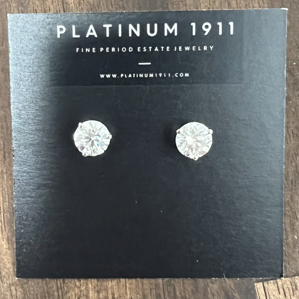 Closeup photo of 4.19tcw Round Brilliant Lab Grown Diamond F-VS1/VVS2 Stud Earrings 14K 3 prong Friction IGI 723567894, 726556293