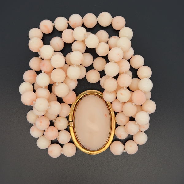 Closeup photo of 18K YG 5 Row Angelskin Coral 9mm Bead Bracelet Large Ornate Engraved Oval Coral 42.5mm Clasp 131.6g, 7.25"