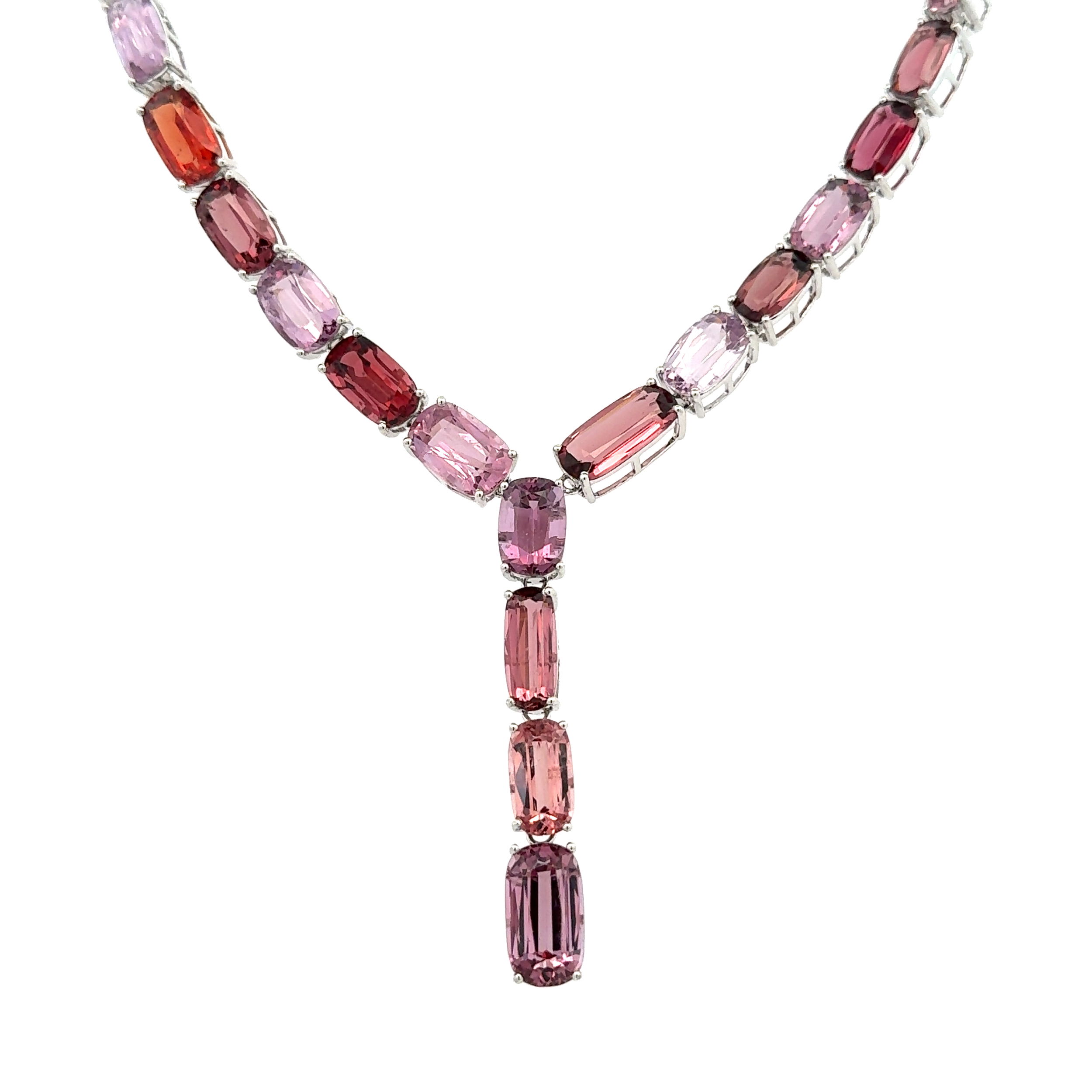 Indulge in the exquisite allure of our 18K White Gold Elongated Cushion Fancy Red & Pastel NO HEAT Spinel Lariat Necklace. This remarkable piece is a statement of opulence and unparalleled craftsmanship, designed for those with a discerning taste for timeless elegance and unique beauty.The necklace is meticulously crafted from 18K white gold, lending a lustrous and sophisticated backdrop to the vibrant spinels. Varying in shape and hue, these captivating gemstones boast a total carat weight ranging from 49 to an impressive 82.56 carats. Each spinel is selected for its breathtaking color and clarity, featuring a rare combination of fancy red and gentle pastel tones that dance with the light.Set in an innovative lariat style, this necklace measures 16 inches in length, offering a graceful drape that perfectly accents any neckline. The design is not only a feast for the eyes but also a testament to expert artistry, ensuring that the spinels are the focal point of the piece.What sets these gemstones apart is their NO HEAT treatment, signifying their all-natural beauty and rarity, further authenticated by the Gemological Institute of America (GIA). This level of authenticity adds significant collectible value, ideal for estate jewelry connoisseurs.Weighing in at 41.3 grams, the necklace has a substantial feel without compromising comfort, making it suitable for both special occasions and everyday luxury. Whether worn to an elegant soirée or as a cherished heirloom, this estate necklace promises to be a conversation starter and a treasured addition to any jewelry collection.Experience the perfect blend of classic elegance and modern sophistication with this remarkable piece, tailored for those who appreciate the finer things in life.GIA# 6234317268 18K WG 49 - 82.56tcw Elongated Cushion Fancy Red & Pastel NO HEAT Spinel GIA Lariat Necklace 41.3g, 16"