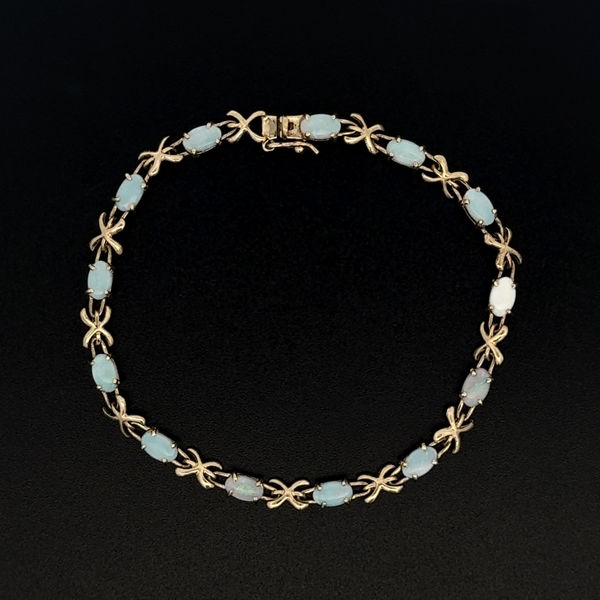 Closeup photo of 14K YG 1.30tcw Oval White Opal & X Link Bracelet 4.1g, 6.5"