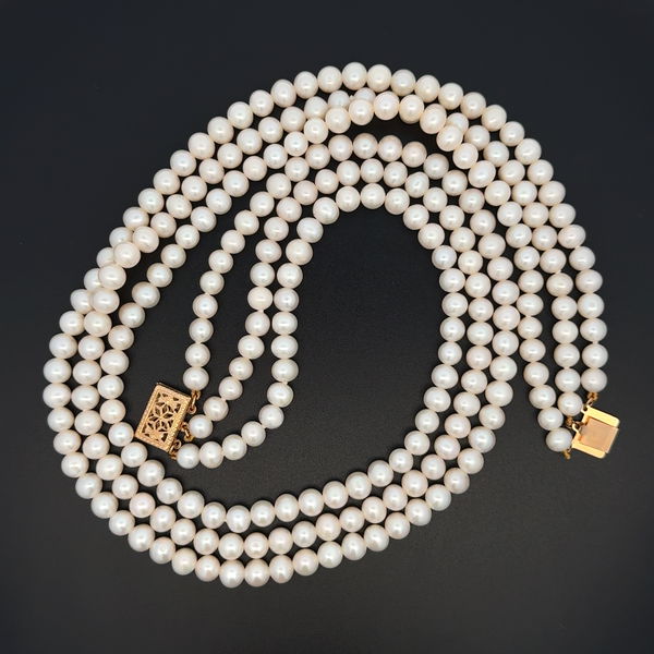 Closeup photo of 14K YG 5.5mm White Cultured Pearl Triple Strand Necklace 55.6g, 16"