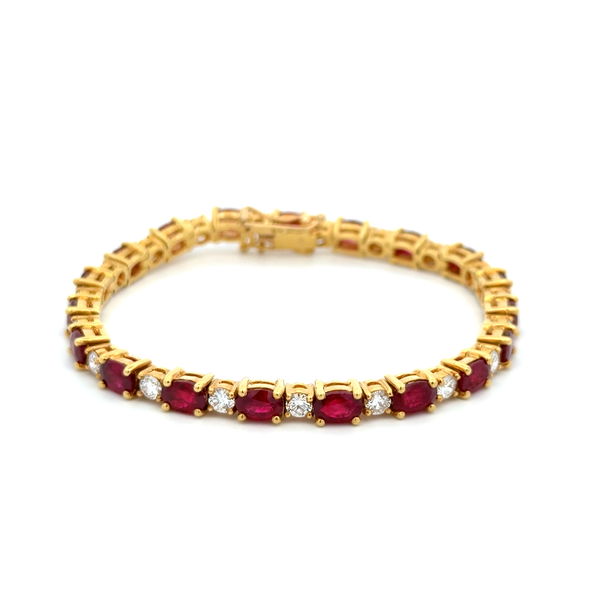 Closeup photo of 18K YG 12.00tcw Oval Ruby & 2.50tcw RBC Diamond Line Tennis Bracelet 23.1g, 7"