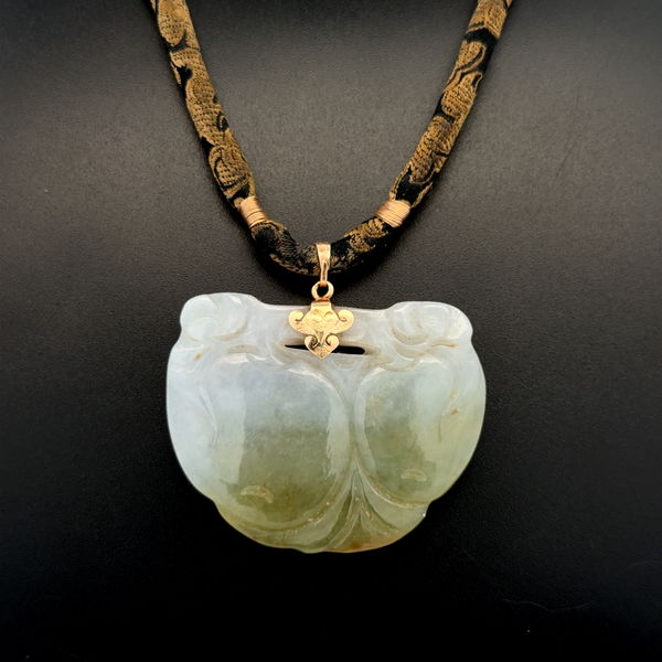 Closeup photo of 14K YG Carved Jade Pendant on Silk Cord 24.1g, 18"
