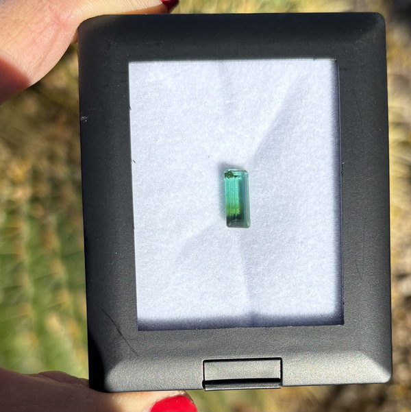 Closeup photo of 2.52ct Emerald Cut Bluish Green Bicolor Tourmaline 11.40x5.31x4.57mm