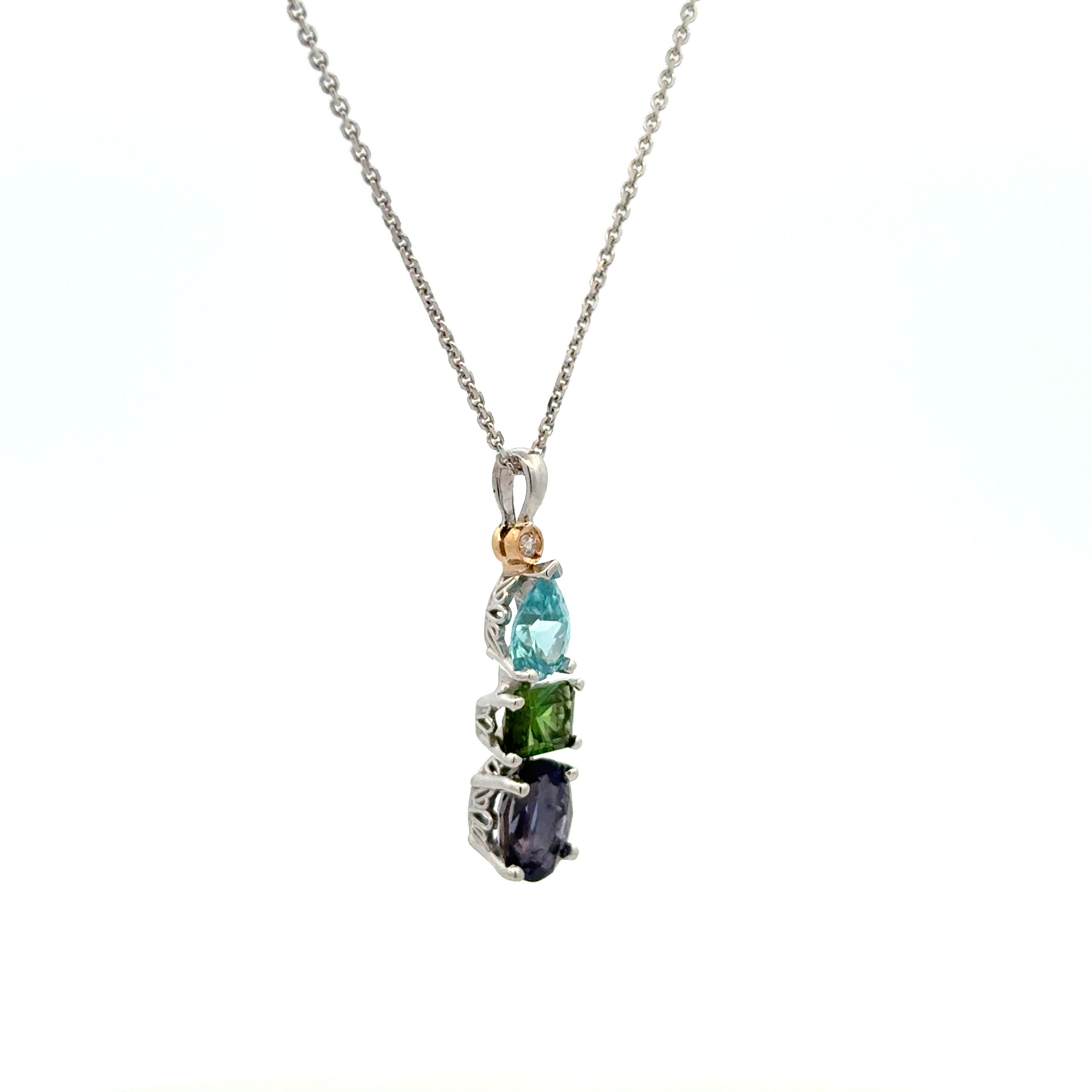14K WG .92ct Pear Zircon, .62ct Green Tourmaline & 1.26ct Oval Iolite & .01ct Diamond Pendant 3.8g, on 925 Adjustable Chain 20" 14K WG .92ct Pear Zircon, .62ct Green Tourmaline & 1.26ct Oval Iolite & .01ct Diamond Pendant 3.8g, on 925 Adjustable Chain 20"