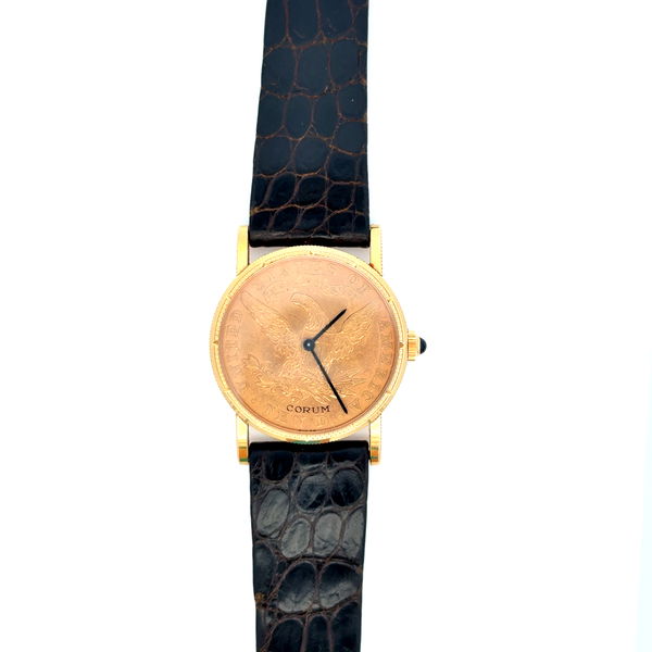 Closeup photo of 18K YG & 22K CORUM $10 1892 Coin Watch Manuel Wind Leather Strap
