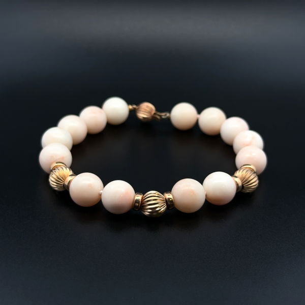 Closeup photo of 14K YG 10mm Round Angel Skin Coral Bead & Gold Bead Bracelet 21.6g, 7.5""