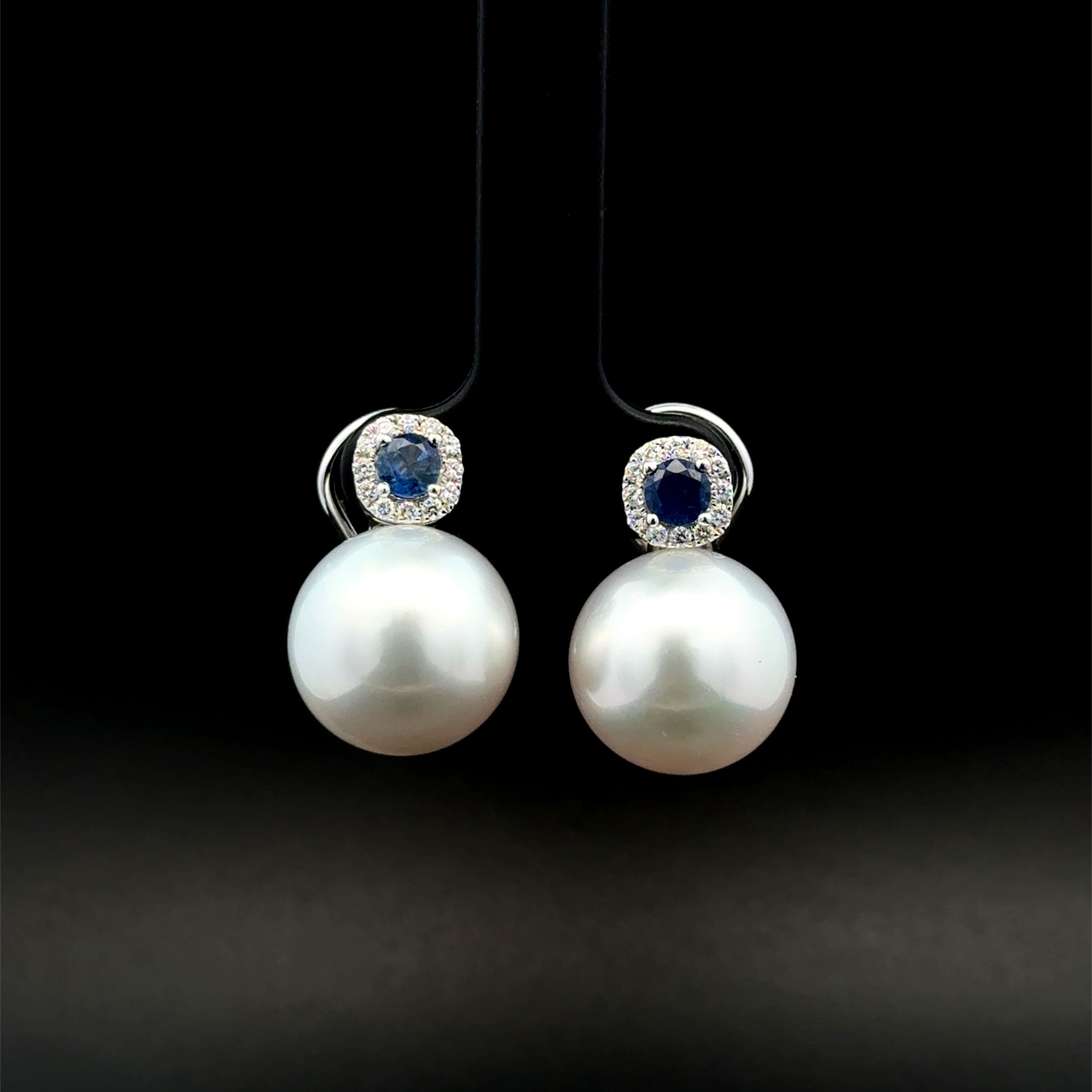18K WG 14mm South Sea Pearl, .60tcw Sapphire & .24tcw Diamond Earrings 13.6g 18K WG 14mm South Sea Pearl, .60tcw Sapphire & .24tcw Diamond Earrings 13.6g