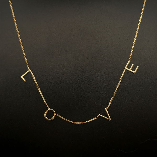 Closeup photo of 14K YG Petite LOVE Letter Station Necklace 1.9g, 16"