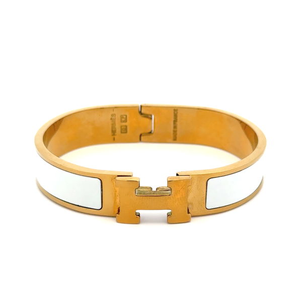 Closeup photo of Hermes Gold Plated White Inlay Clic H Cuff Bracelet 35.2g