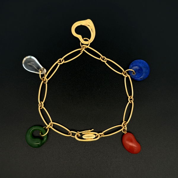 Closeup photo of 18K YG TIFFANY & CO Elsa Peretti Spain Gemstone Charm Bracelet 13.2g, Carnelian, Lapis, Crystal, Jade