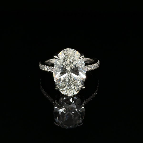 Closeup photo of 14k WG 6.05ct Oval Lab Grown Diamond IGI #LG761543079 & .56tcw LB RBC Diamond Engagement Ring 5.3g s6.5