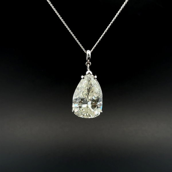 Closeup photo of Platinum 11.70ct Pear Shape Diamond L-I1 Laser Drilled Solitaire Pendant 7.6g on 14K Chain 18"