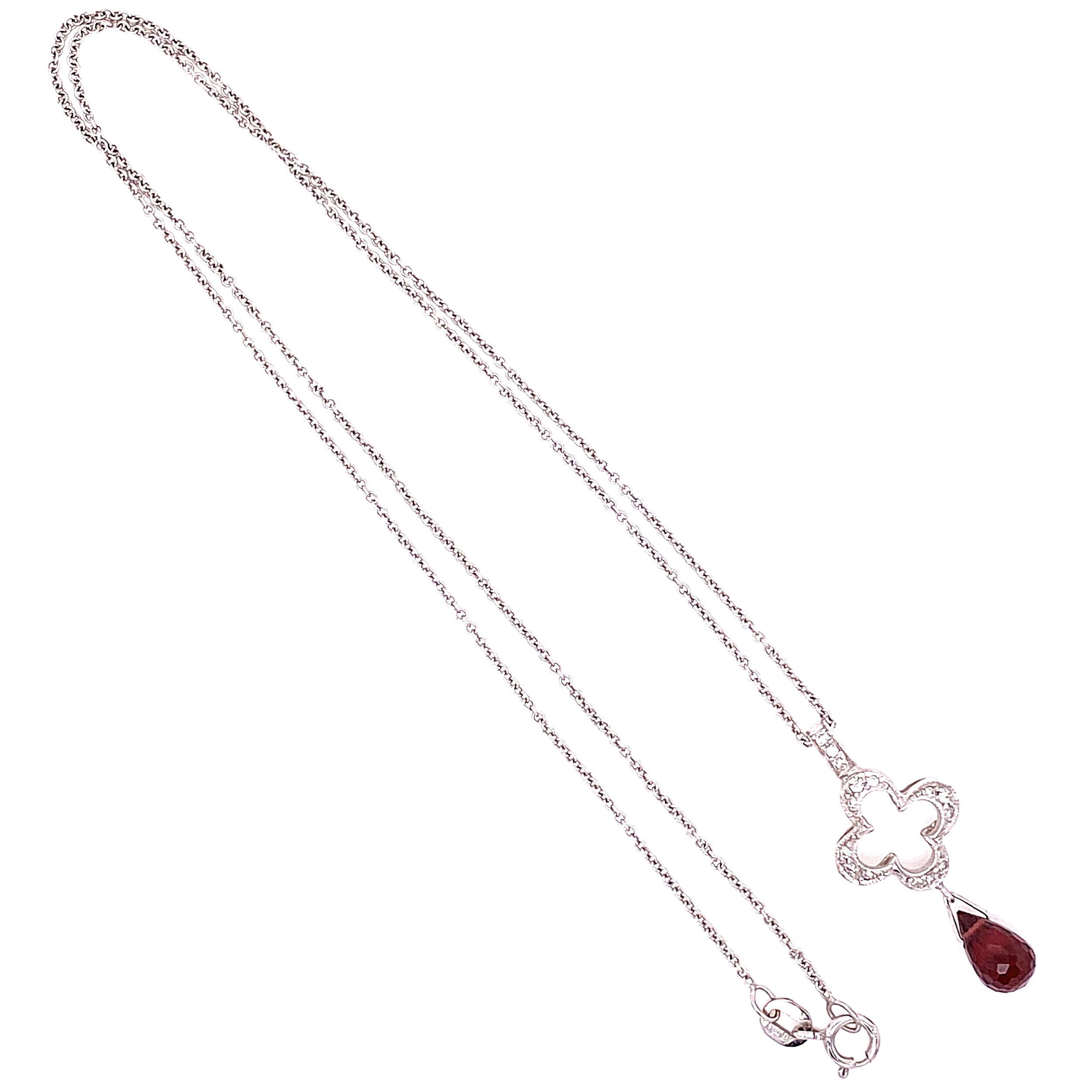 Classic Jude Frances Diamond Clover with red Garnet Briolette drop. The gross weight is 2.9g and the chain is 16" in length 18K White Gold JUDE FRANCES Open Clover .09tcw Diamond Pendant