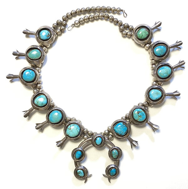 Closeup photo of 925 Sterling Native Squash Blossom 12 station Turquoise Necklace