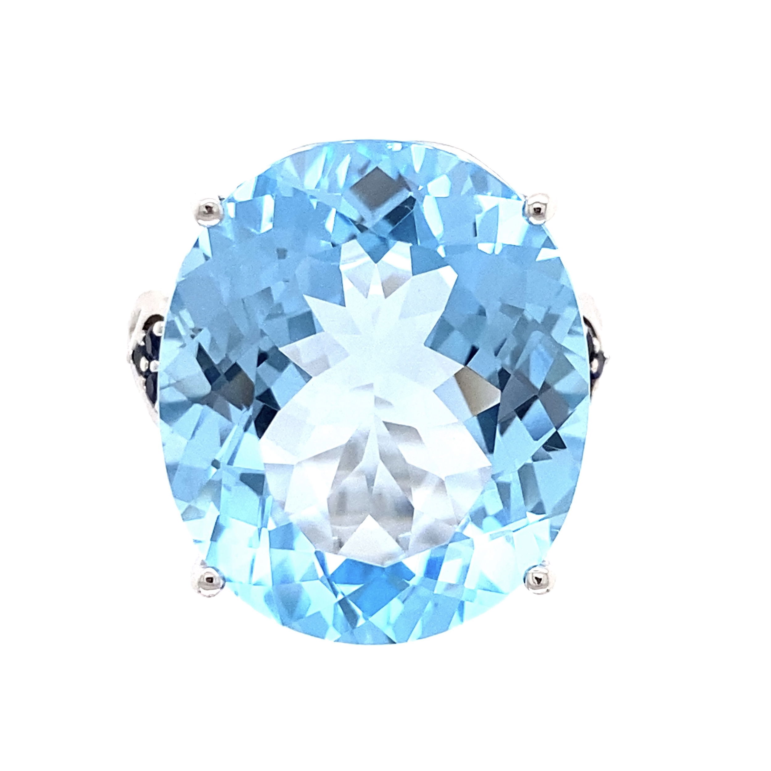 14K WG 12.00ct Oval Blue Topaz & .10tcw Sapphire Ring 8.8g, 7.25