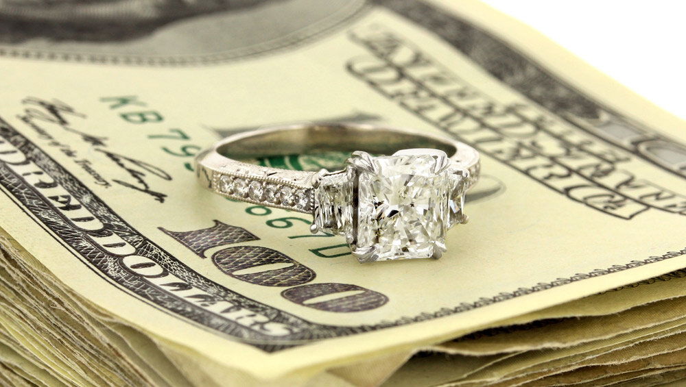 Close-up of a diamond engagement ring being evaluated for sale