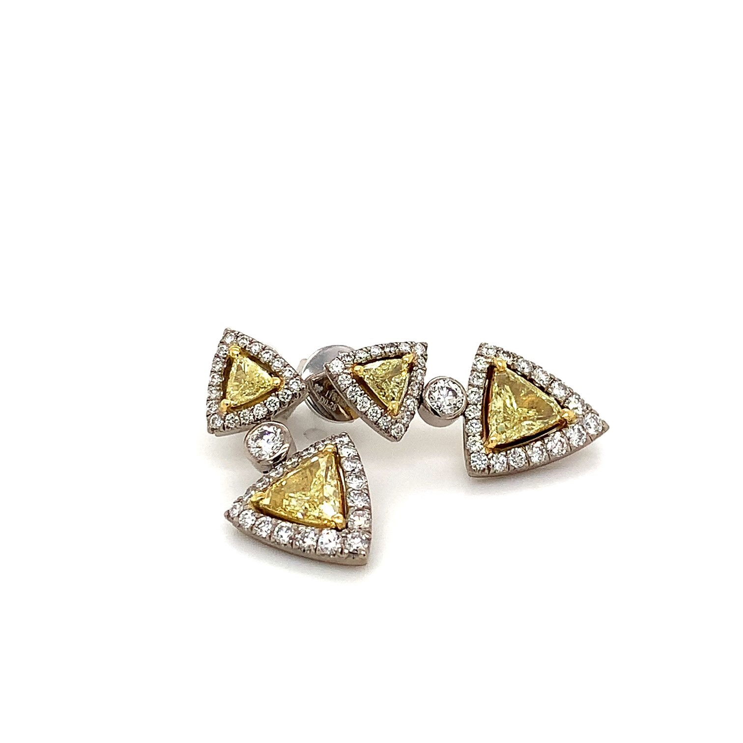 Treat yourself or the special someone in your life to these dazzling earrings! These 18k two-tone gold earrings feature 1.36tw of Fancy Intense Yellow diamonds set in white gold. The unique design is perfect for everyday or special occasions. These earrings are custom made, so you can be sure your piece is unique and one of a kind! Crafted with quality in mind, these earrings are sure to make a statement. 18k Two-Tone Gold 1.36tw Fancy Intense Yellow Diamond Earrings