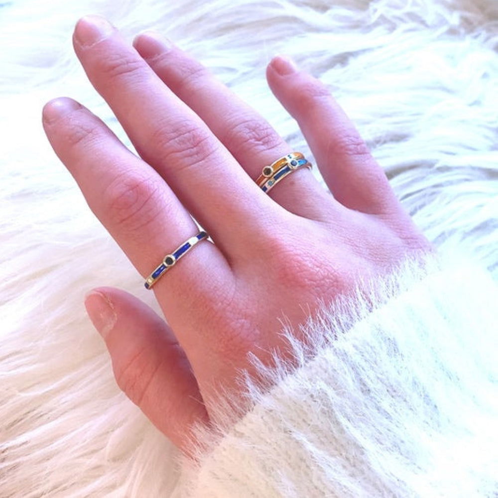 balanced stack of lord stacking rings on multiple fingers