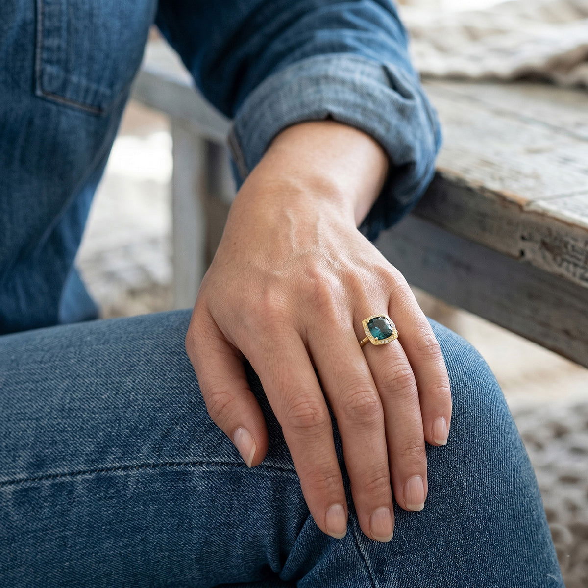 blue sapphire engagement ring on hand denim Alara Bozeman