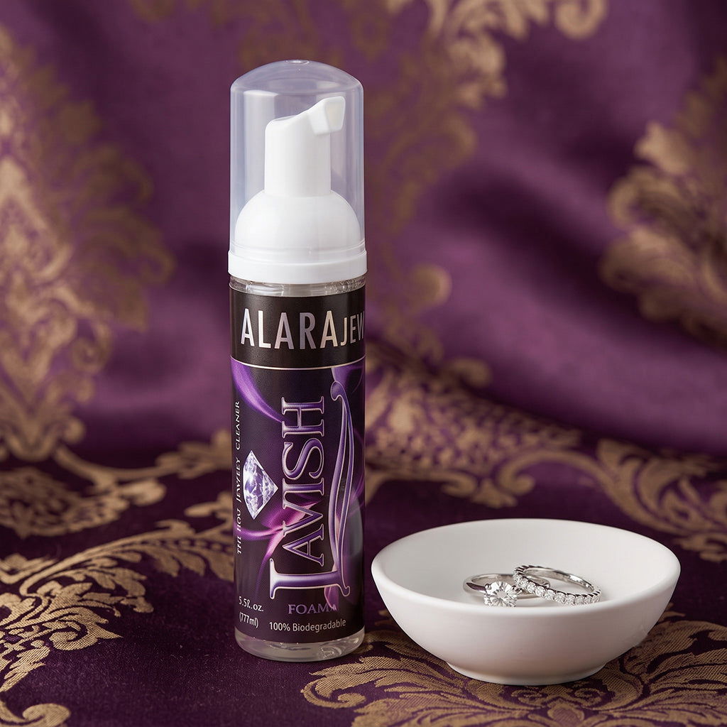 At-home diamond ring cleaning setup with polishing cloth, foaming jewelry cleaner, and soft brush.