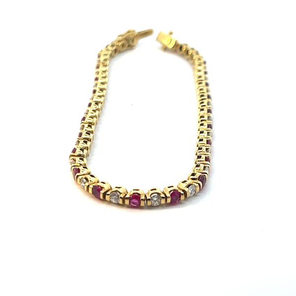 Closeup photo of 18KY 2ct Ruby & 1.25ct Diamond Line Bracelet. 11g
