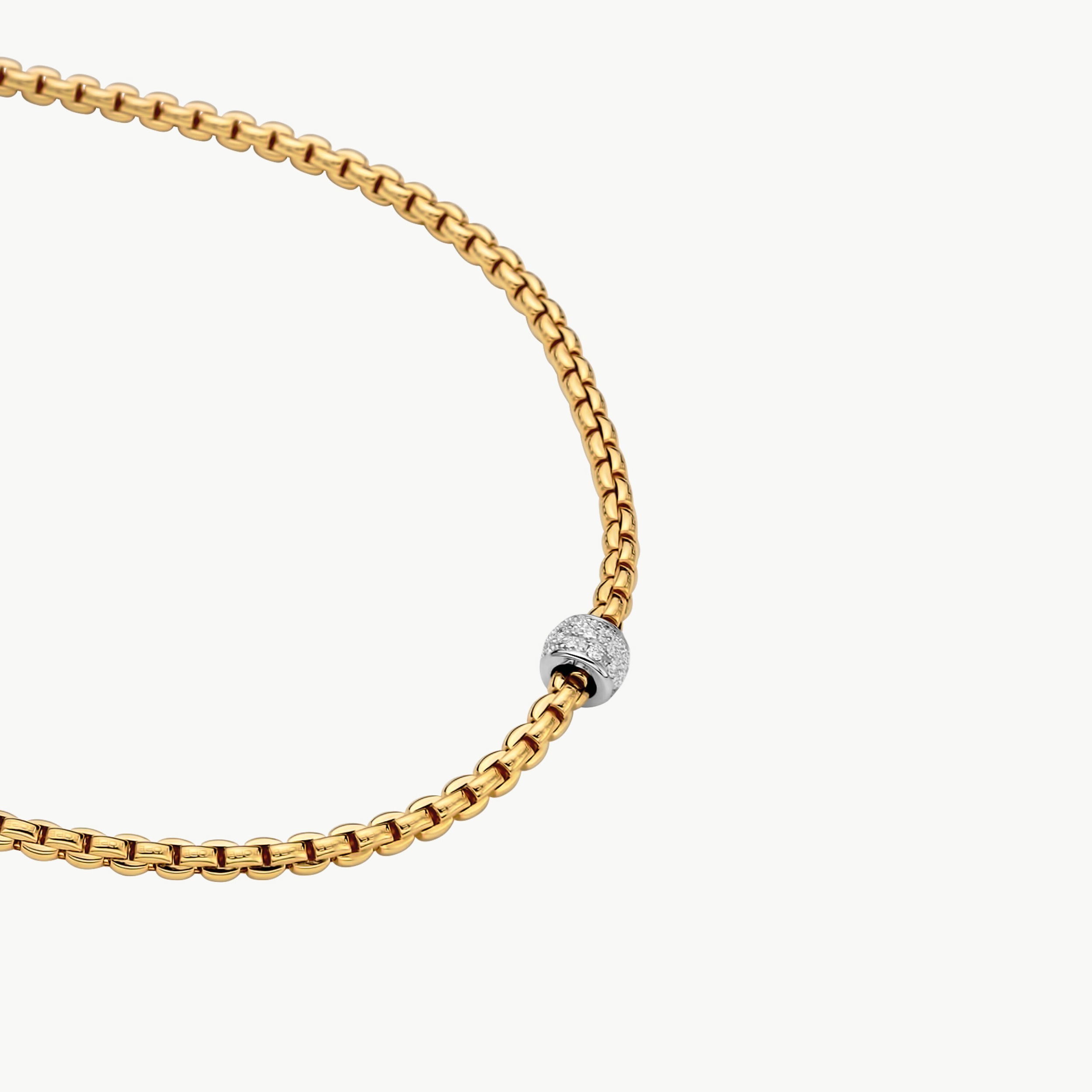 Eka Tiny Collection rope necklace in 18kt yellow gold with white gold element covered in 0.19ctw of white diamond pave - The necklace measures 3mm in diameter and 45cm (17.7 inches) long. 730C PAVE-YW-45CM Eka Tiny Collection Rope Necklace in 18kt Yellow Gold with White Gold and White Diamond Element - 3mm - 45cm