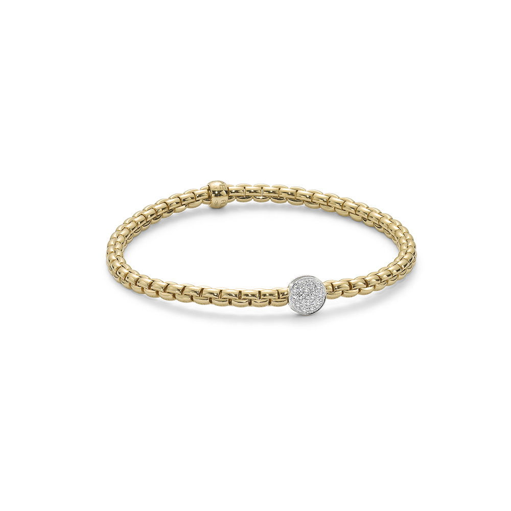 Eka Tiny Flex'It Bracelet in 18kt Yellow Gold with One White Gold and White Pave Diamond Circle Element at 0.22ctw - The bracelet measures 4mm in diameter and is a size small, 16cm or 6.29 inches internal circumference. 736B PAVES-YW Eka Tiny Bracelet in 18kt Yellow Gold with 1 White Gold and White Diamond Pave Circle Element - 4mm - Size S