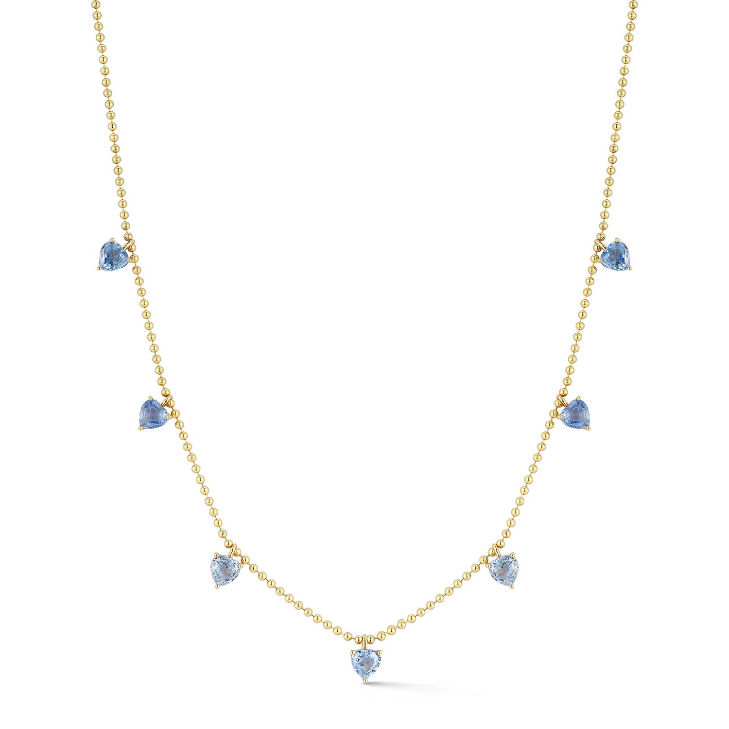The Hearts Club Floating Heart Necklace with Seven Blue Sapphires in 18kt Yellow Gold by Katherine Jetter. Seven 4mm blue sapphire hearts at 2.30ctw hang delicately off an 18 inch adjustable ball chain in 18kt yellow gold. The Hearts Club Floating Heart Necklace with Seven Blue Sapphires in 18kt Yellow Gold