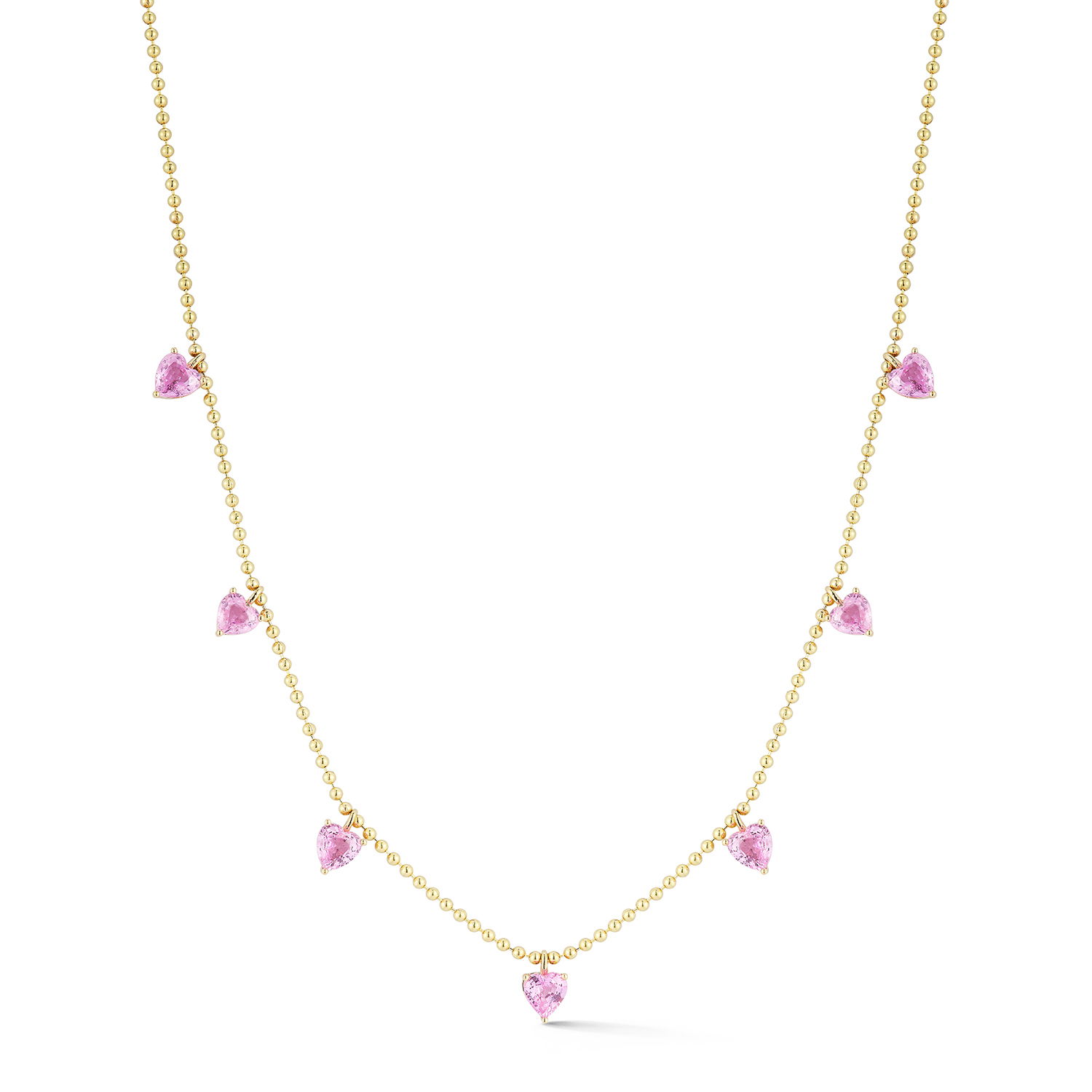 The Hearts Club Floating Heart Necklace with Seven Pink Sapphires in 18kt Yellow Gold by Katherine Jetter. Seven 4mm pink sapphire hearts at 2.00ctw float on a delicate 18kt yellow gold adjustable ball chain. The Hearts Club Floating Heart Necklace with Seven Pink Sapphires in 18kt Yellow Gold