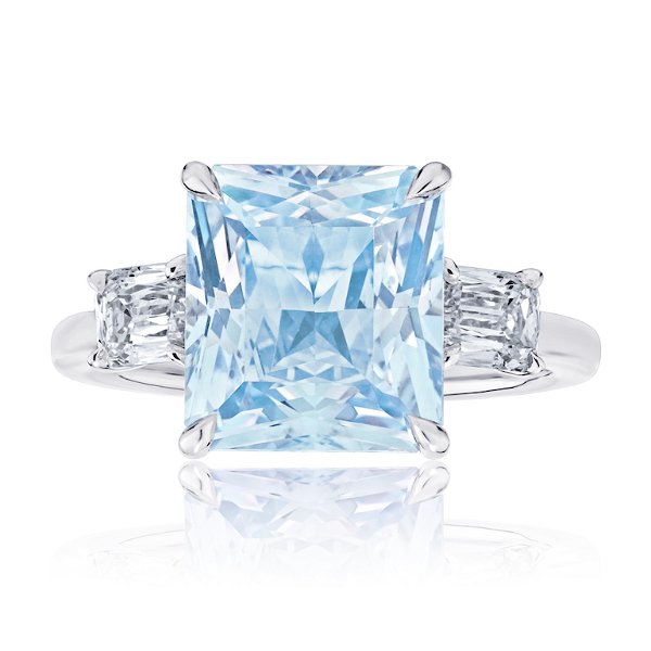 Closeup photo of 5.32 Carat Radiant Cut Light Blue Sapphire With Two Antique Cushion Cut Diamonds Platinum Ring