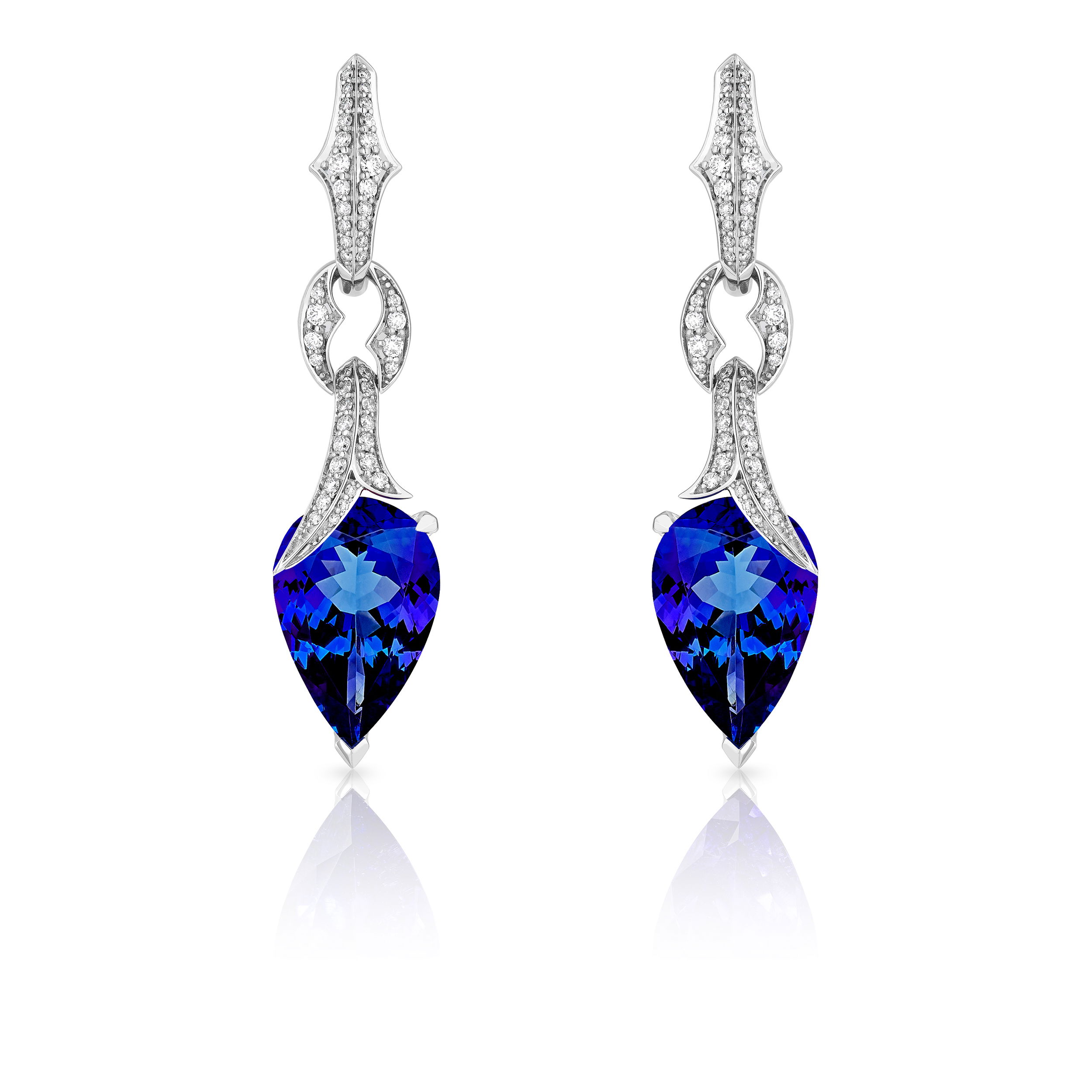 Thorn Embrace Pear Drop Earrings with Tanzanite and White Diamonds in 18kt White Gold by Stephen Webster. Drop earrings with two pear shape tanzanites at 13.56ctw and accented with white diamond pave at 0.86ctw. Thorn Embrace Pear Drop Earrings with Tanzanite and White Diamonds in 18kt White Gold