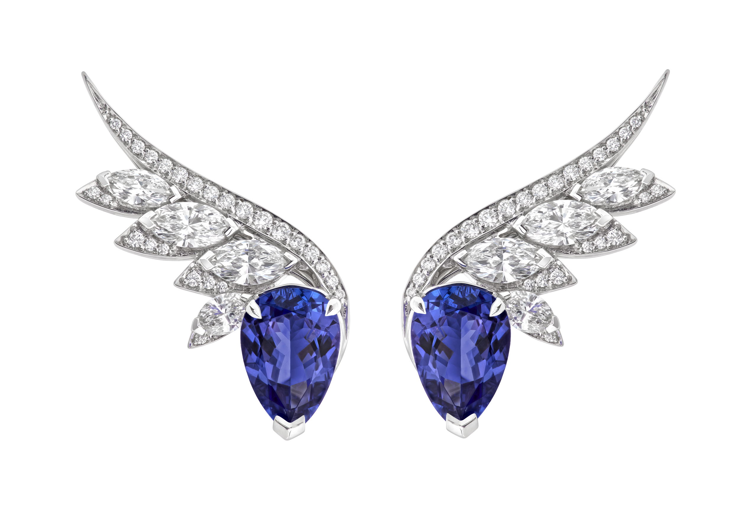 Magnipheasant Plumage Couture Earrings with Tanzanite and White Diamonds in 18kt White Gold by Stephen Webster. Climber stud earrings in 18kt white gold with two pear shape tanzanites at 4.99ctw, marquise cut white diamonds at 1.98ctw and white diamond pave at 0.32ctw. Magnipheasant Plumage Couture Earrings with Tanzanite and White Diamonds in 18kt White Gold