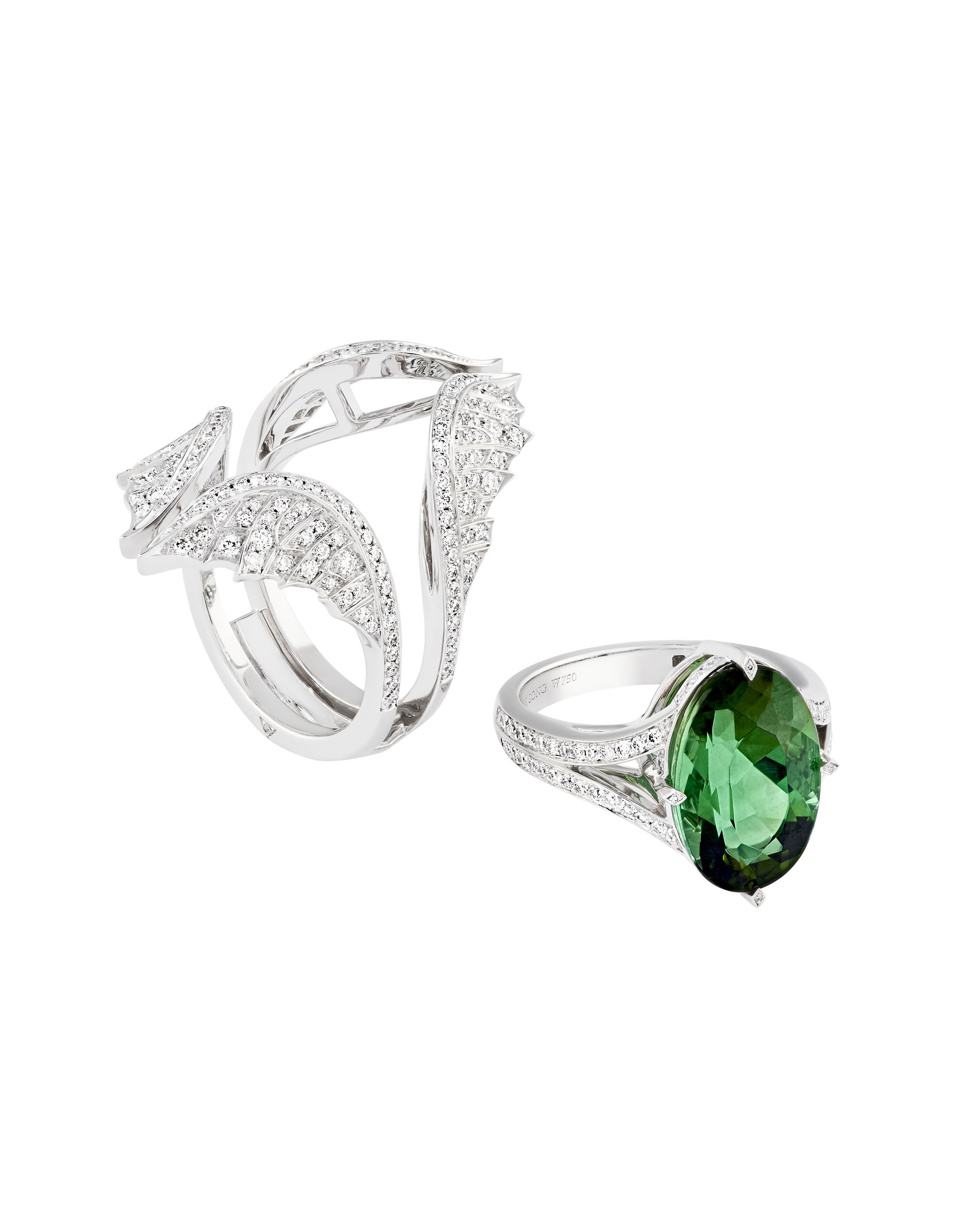 The Rebelles Swan Song Ring with Green Tourmaline in 18kt White Gold - Size 8 by Stephen Webster. The ReBelles - Swan Song - Inner ring 18K White gold , ring set with White diamond pave 0.45ctw and a center green Tourmaline 6.81cts. - Outer ring 18kt White gold, ring set with White diamond pave 1.04ctw. Number 7/10. Taking inspiration from Anna Pavlova, probably the most famous ballet dancer and a heroine to generations of young ballerinas. Set in 18kt White Gold with a central Green Dichroic Tourmaline and White Diamonds. Limited production of 10 per design. Each piece is numbered and engraved with SWAN SONG. The Rebelles Swan Song Ring with Green Tourmaline in 18kt White Gold - Size 8
