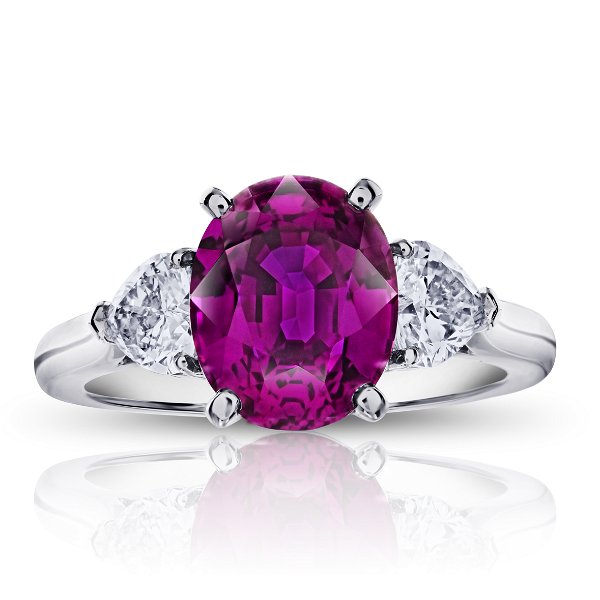 Closeup photo of 4.49ct Oval Pink Sapphire with Heart Shaped Diamonds in Platinum