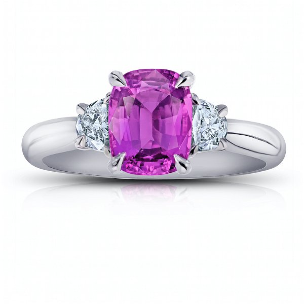 Closeup photo of 2.22 carat Pink Cushion Sapphire with half moon shape diamonds .34 carats set in platinum ring.